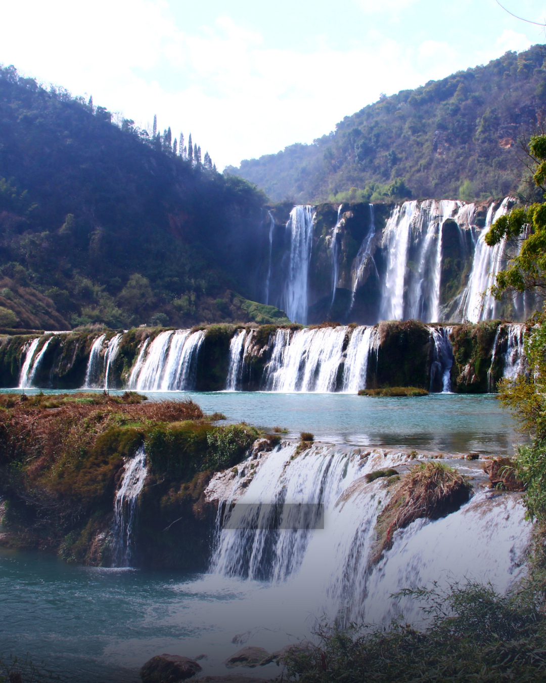 Xingyi > Yunnan "Luoping" > Experience the magnificence of waterfalls 【Jiulong Waterfall Group Scenic Area】 (Includes entrance ticket + *Electric bamboo raft and sightseeing car) > Photographer's paradise "Dongchuan Red Land" 【Lepu'ao Terraced Fields, Jinxiuyuan Colorful Slope】 > Yunnan "Xundian"：Jiulong Waterfalls