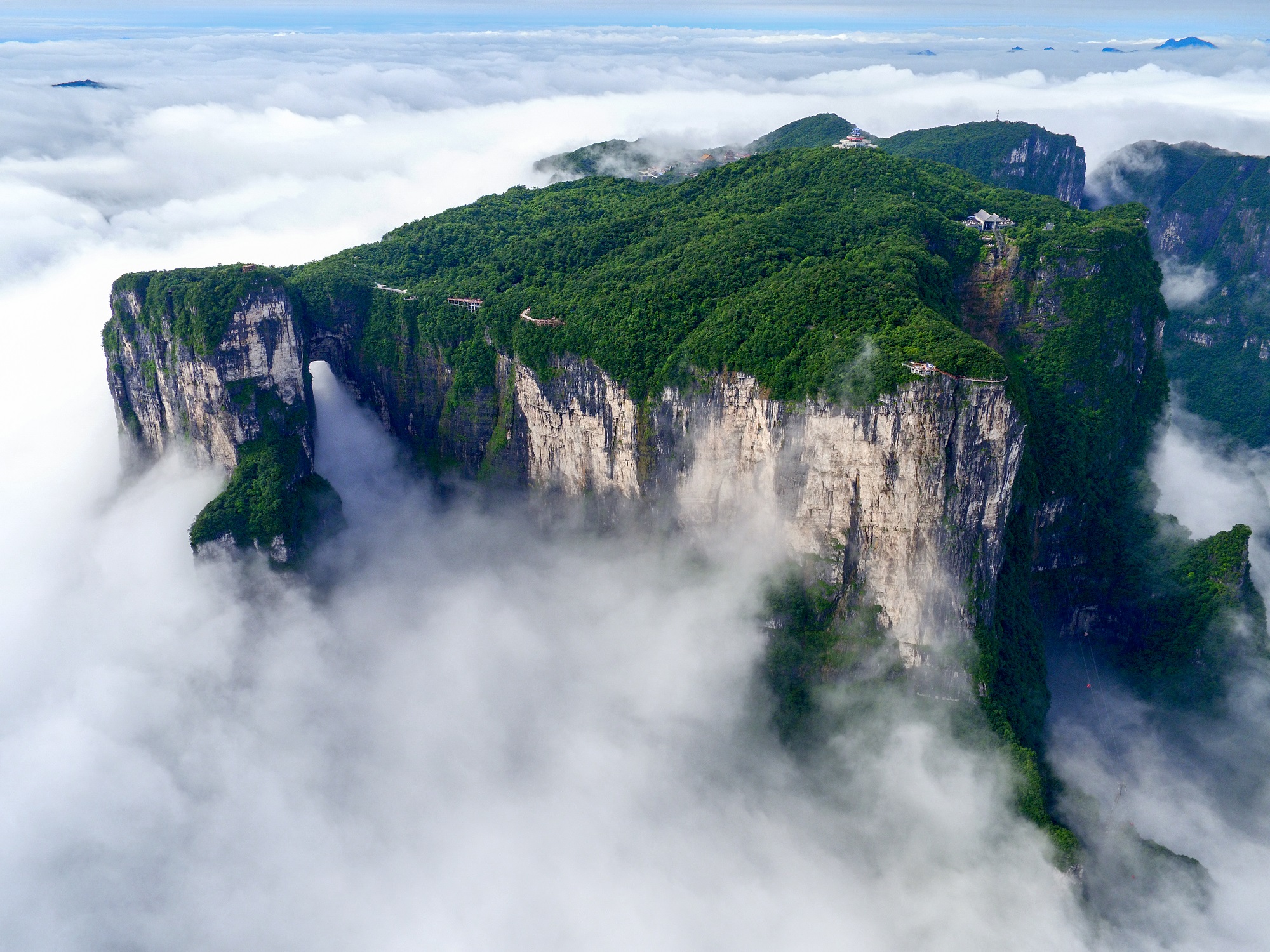 Zhangjiajie > 【Tianmen Mountain National Forest Park】 (including cable car + mountain-penetrating escalator + glass walkway and shoe covers) > Tujia Brocade Museum > 【Optional item: Tujia Gannian Feast (details please see attached page)】:Tianmen Mountain National Forest Park